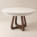 Selenite — Round Extendable Dining Table — Front three-quarter view
